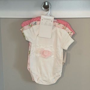Three cute baby onesies for baby girl.
